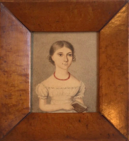 Gorgeous miniature of a girl with her book 